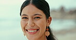Face, smile and funny with woman on beach for travel, holiday or vacation on tropical coast. Portrait, relax and happy young tourist on island paradise by ocean or sea for weekend getaway in summer