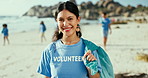 Face, volunteer and woman at beach for cleaning trash, recycling and environment conservation. Portrait, charity and smile of person at ocean for community service, sustainability and ecology at sea