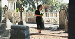 Flowers, graveyard or woman by tombstone for funeral, death ceremony or memorial service. Pain, sad female person or bouquet by gravestone for mourning, burial or loss in public cemetery for farewell