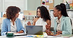 Business women, meeting and collaboration on laptop for creative ideas, discussion and feedback with project. Professional group of people or designer on computer for social media or website planning