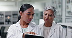 Science, research and women with tablet for teamwork in medical study, results or online review. Digital app, advice and scientist in laboratory with technician in consultation for advice on report.