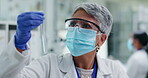 Woman, chemical in test tube and senior scientist in lab, chemistry and medical research for pharmacy and investigation. Biotech, science experiment and doctor in face mask with glass for liquid