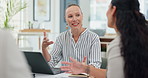 Businesswoman, laptop and communication with meeting for planning, collaboration and brainstorming. Employees, office and desk with teamwork for discussion, ideas and feedback for work project