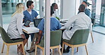 Medical, team and meeting for healthcare in conference room with technology, documents and discussion. Collaboration, doctor and nurse group in boardroom for surgery brainstorming and health planning