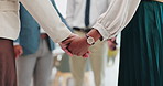 Business people, holding hands and meeting with team for unity, collaboration or support group at office. Closeup of employees touching for love, care or trust together in diversity at the workplace