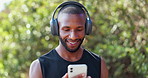 Man, runner and music with phone for fitness in nature with dancing for exercise, workout and training or smile. Athlete, african person or headphones with radio, podcast or audio for running in park