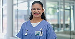 Portrait, happy and employee in hospital as professional for healthcare, wellness and medicine. Medical, worker and female person in clinic for service for cardiology, career and girl with smile