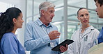 Doctors, group and senior man with tablet for planning, discussion and review for medical study. People, medic and nurse with digital touchscreen in lobby for meeting, talking and advice in hospital