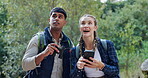 Outdoor, forest and adventure for couple with phone and binoculars for navigation in woods for journey. Location, man and woman in relationship on date for travel in nature with mobile and technology