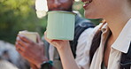 Friends, tea and cup on hike outdoors, conversation and hot drink for break on trek in woods. Closeup, laughing and coffee on holiday or vacation in forest, happy and talking on travel in nature