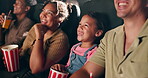 Theater, watching movie and happy family eating popcorn together with kid, mother and father laughing. Audience, snack and girl child at cinema with parents for funny film, comedy or entertainment