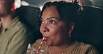 Black woman, drink and surprise in cinema for movie with wow or excited expression or emotion on face, reaction and awe. Female person, theatre and reaction for film with milkshake for enjoyment