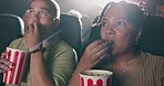 Theater, watching movie and woman eating popcorn together with family, kid and father. Audience, snack or people at cinema with food for fantasy film, show or entertainment at auditorium with parents