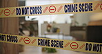 Crime scene, tape and evidence in house for case, inspection and investigation in living room. Apartment, home and lounge with warning from police, forensic and analysis of in flat for justice