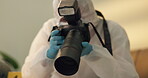 Forensic, photographer and csi at crime scene for investigation of house burglary or murder analysis. Evidence, person and digital pictures in hazmat for observation, examination and case research