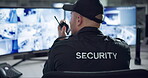 Security guard, computer screen and cctv surveillance on radio for inspection service and building safety with rear view. Control room, officer and man with walkie talkie in data center with talking