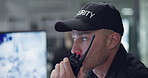 Man, walkie talkie or speaking with cctv monitor for protection, security service or building safety. Face, video surveillance agency or guard in control room with camera footage for crime at night