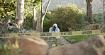 Csi, photographer and evidence at crime scene for investigation in forest with police tape and safety hazmat. Forensic quarantine, expert investigator and pictures for observation and case research