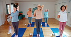 Senior woman, yoga and stretching with people in pilates for zen, spiritual wellness or balance together. Elderly group, yogi or coaching in fitness exercise for warm up, awareness or health on mat