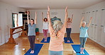 Senior woman, trainer and stretching with yoga class for zen, spiritual wellness or balance together. Elderly people, yogi or group with coach for fitness, exercise or pilates in awareness on mat