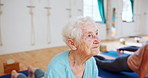 Elderly woman, stretching and yoga with class for pilates, spiritual wellness or balance together. Senior people, yogi and coaching in zen, fitness or svanasana pose for awareness or indoor exercise