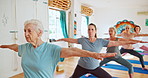 Elderly woman, yoga and stretching with class for spiritual wellness or balance together. Senior people, yogi and coaching in relax, fitness or warrior pose for awareness, zen or indoor exercise