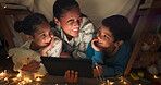 Funny, tablet and mother with children in a tent house streaming internet video, show or movie online in the night. Dark, digital and parent or dad relax with kids watching comedy in the evening