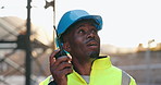 Walkie talkie, engineering and man construction worker on site for inspection with communication. Quality check, architecture and African male industry foreman with radio for project management.