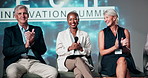 Presentation, conference and business people on a stage, applause for thank you, success or well done. Teamwork, speakers and men and women in seminar, tradeshow or convention for tech and innovation