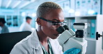 Science, research and black woman at microscope checking results in pharmaceutical test in laboratory. Glasses, safety and scientist studying sample with medical innovation for vaccine development