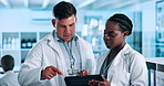 Scientist, teamwork and tablet in laboratory for medical research, data analysis and collaboration on vaccine. Diversity, science people or mentor with technology for planning, discussion or report