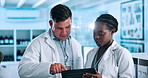 Scientist, teamwork and tablet in laboratory for data analysis, medical research and collaboration on vaccine. Diversity, science people or mentor with technology for planning, discussion or report