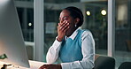 Black woman, computer and tired at night in office, typing and online research for creative project. African person, journalist and burnout with yawning by desk and editing a blog on company website