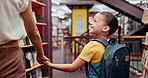 School, tutor or kid in a library walking with smile for knowledge or development for future learning. Scholarship, education or happy student at school ready to start studying or search with parent