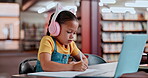 Laptop, headphones and girl online school, learning and growth of development, child and student. Video call, internet and female person writing for education on desk of library, paper and test