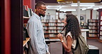 Couple, talking or man with woman in library for research, college education or knowledge in books. University, conversation and students in campus learning, speaking and studying for scholarship