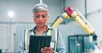 Mature woman, machine and tablet in factory for communication, contact or information for work in industrial career. Female person, engineer or manager with technology for planning or distribution