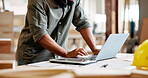 Hands, man and architecture with typing on laptop in desk for building ideas and research. Closeup, technology and online  as engineer or builder with startup business for construction project.