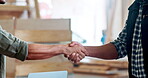 Carpenter, handshake or agreement with closeup, building and startup collaboration. Handyman, workshop and partnership for manufacturing, deal or maintenance or renovation with lumber for project