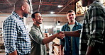 Handshake, men meeting and carpenter in workshop for partnership, team for agreement and deal in trade. Industry, wood work group and intro with shaking hands, support and collaboration at factory