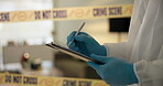 Hand, house and crime scene with writing for evidence or notes in robbery for evidence, safety and report. Forensics, police tape and investigation at home for dna, analysis and criminal activity.