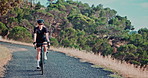 Woman, mountain and road with cyclist, fitness and exercise bike with nature and training with sunshine. Friends, bike and cycling with wellness and hobby with weekend break and activity with safety