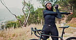 Black woman, stretching and bike for cycling with fitness outdoor, rider ready for race and workout in park. Flexibility, training and start with bicycle in nature, cyclist for exercise and sports