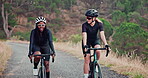 Women, cycling or road as fitness, health or adventure as training, workout or exercise on mountain. Female friends, bicycles or safety gear to balance, ride or performance in bonding in countryside