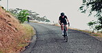 People, cycling and mountain or fast downhill for sports exercise on misty morning for workout, fitness or training. Person, bike and adventure in nature for triathlon wellness, outdoor or challenge
