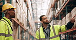 Logistics, man and manager in warehouse talking, pointing and planning inspection for distribution safety. Teamwork, supply chain and people in factory for quality control, partnership and discussion