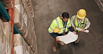 Man, team and documents with architect in warehouse for construction, planning or inspection above. Top view of male person, engineer or contractors with blueprint, paperwork or floor plan at depot