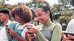 Phone, happy and friends in park at university for social media, networking and online chat on bench. College, campus and men and women laugh on smartphone for funny website, internet meme and text