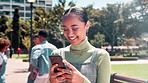 Happy woman, student and laughing with phone at university for social media, communication or networking in nature. Female person or learner with smile on mobile smartphone or online chatting at park