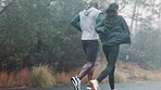 Man, woman and running exercise on mountain road for workout endurance, marathon or training. People, legs and fitness shoes on nature path in cold weather for morning routine, athlete or wellness
